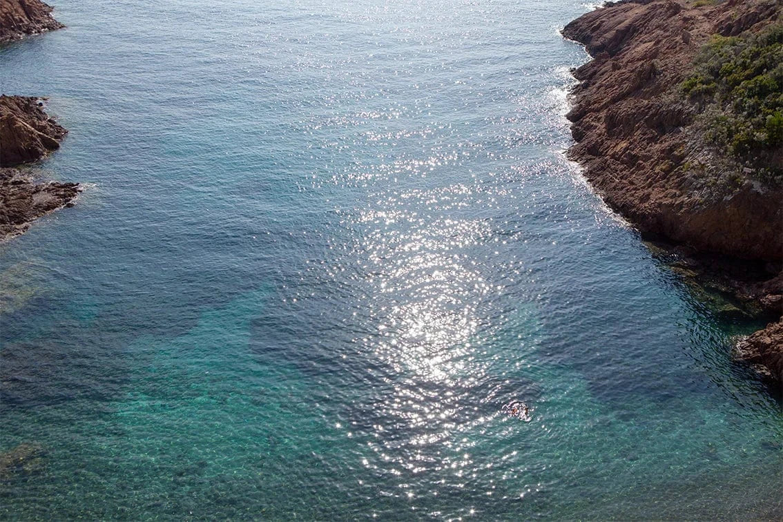 Scenic image of the ocean and rocky sides. 